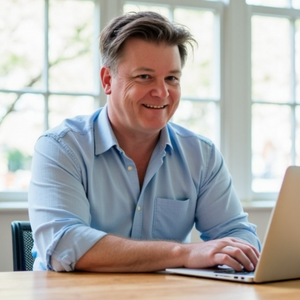 Modbands owber Craig sitting at a desk on a laptop